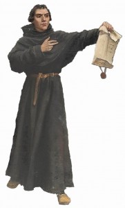 O heresiarca Lutero, antes de queimar a Bula papal de sua excomunhão, a mostra a seus sequazes. 